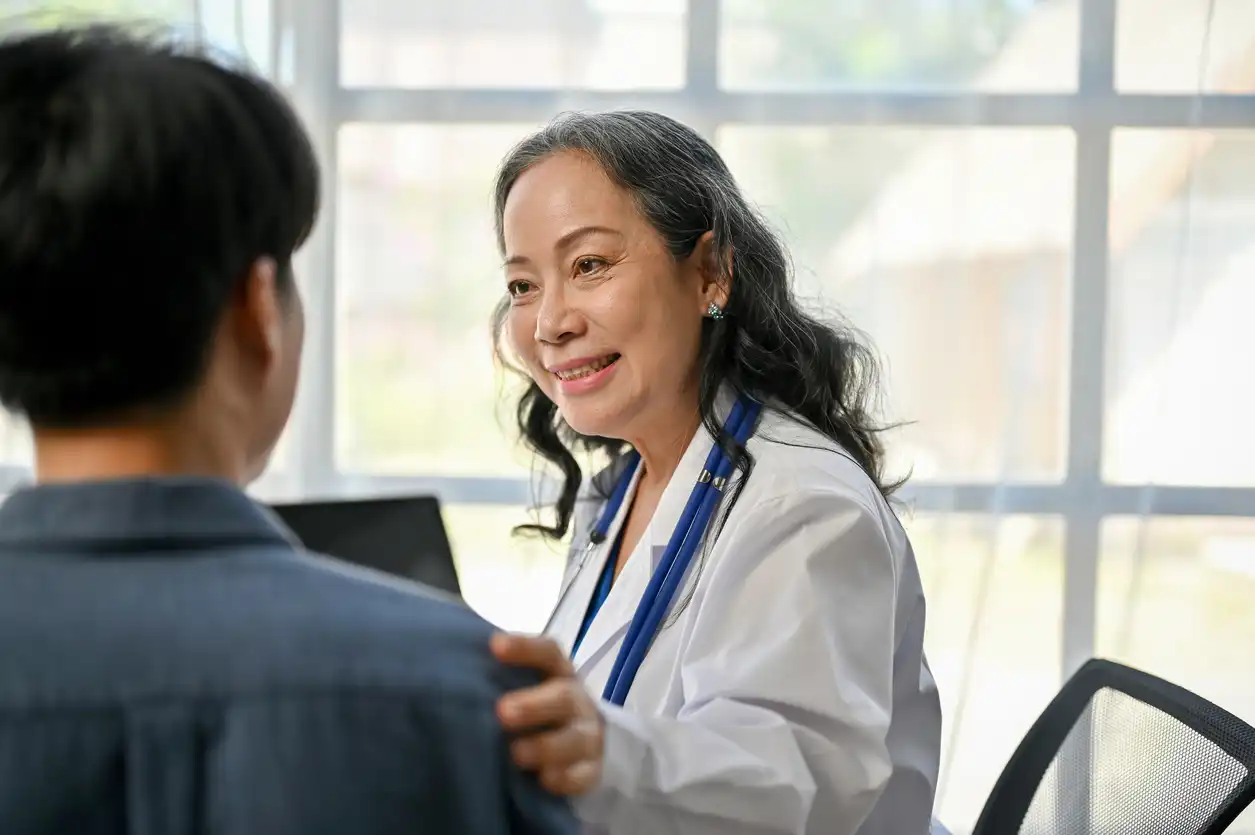 Primary Care Provider Speaking Compassionately with a Patient