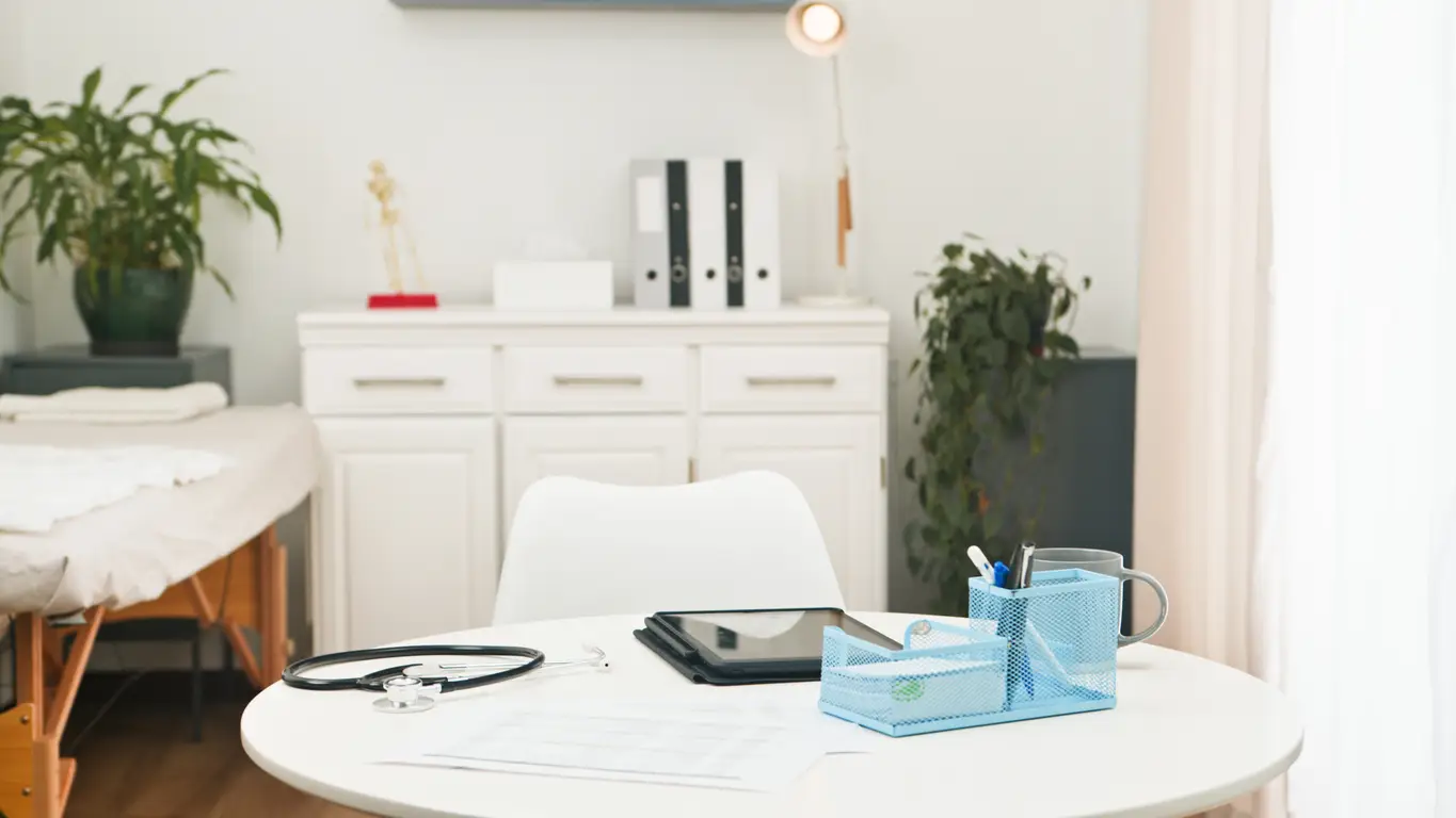 Calm ambulatory practice workspace representing reduced burnout through healthcare data management