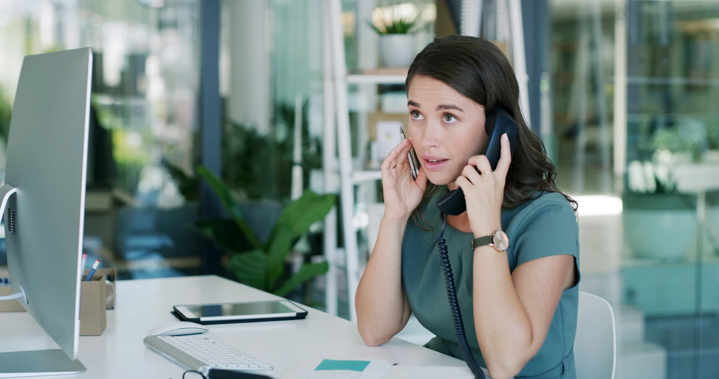 Medical provider on phone working through a prior authorization delay and bottleneck affecting claim approval.