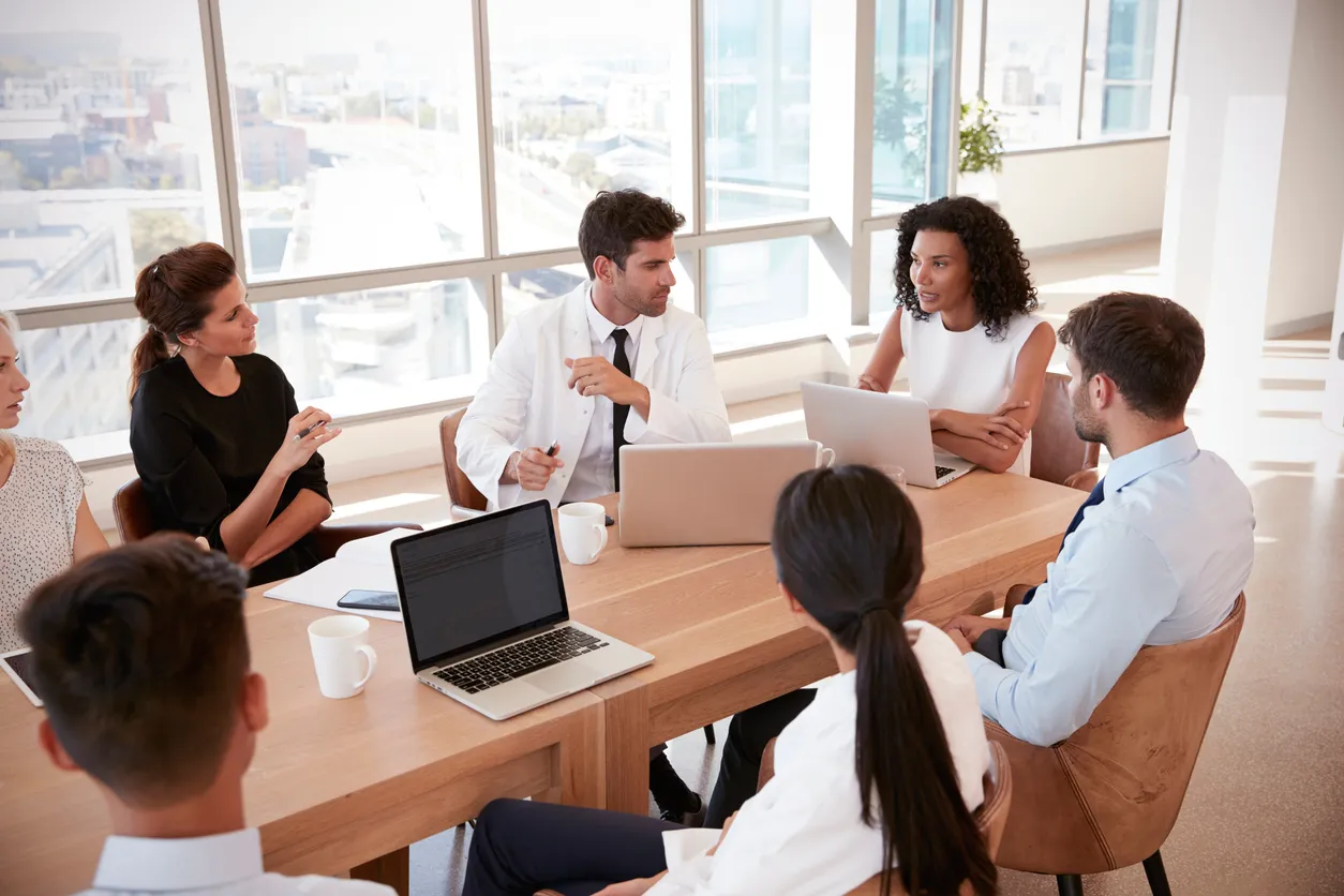 Healthcare leaders discussing AI-driven healthcare technology solutions