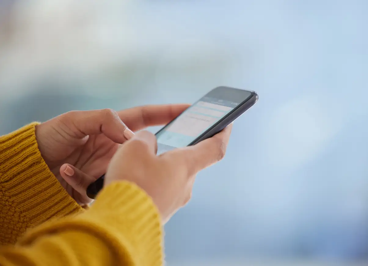 Patient receiving an automated medical appointment reminder on a smartphone