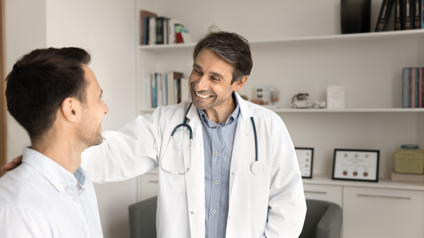 Physician engaging with a patient in a calm, efficient environment with reduced administrative stress