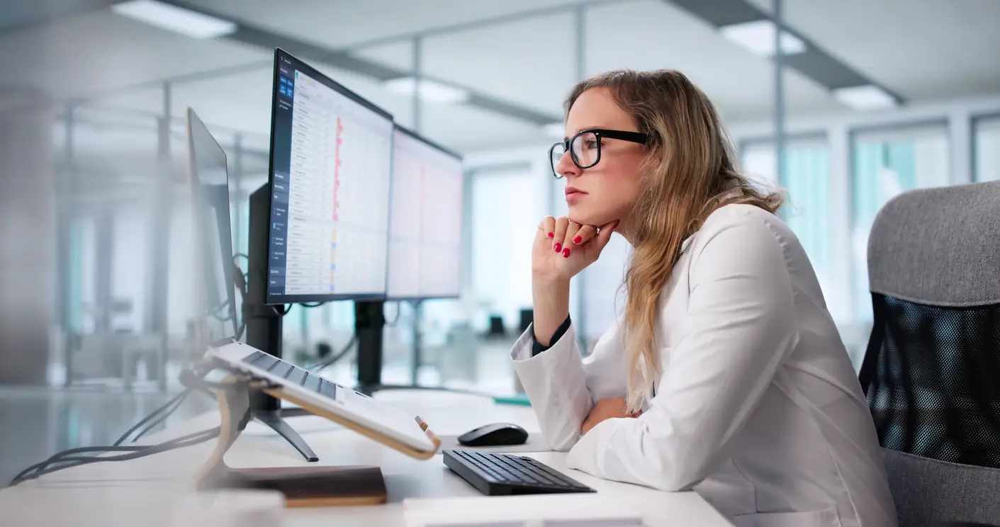 Revenue cycle specialist reviewing claims and billing performance