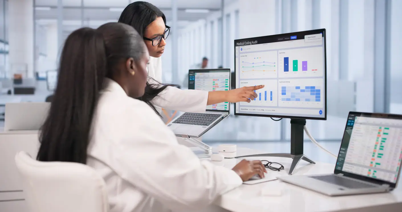 Healthcare team analyzing revenue cycle performance and practice management analytics