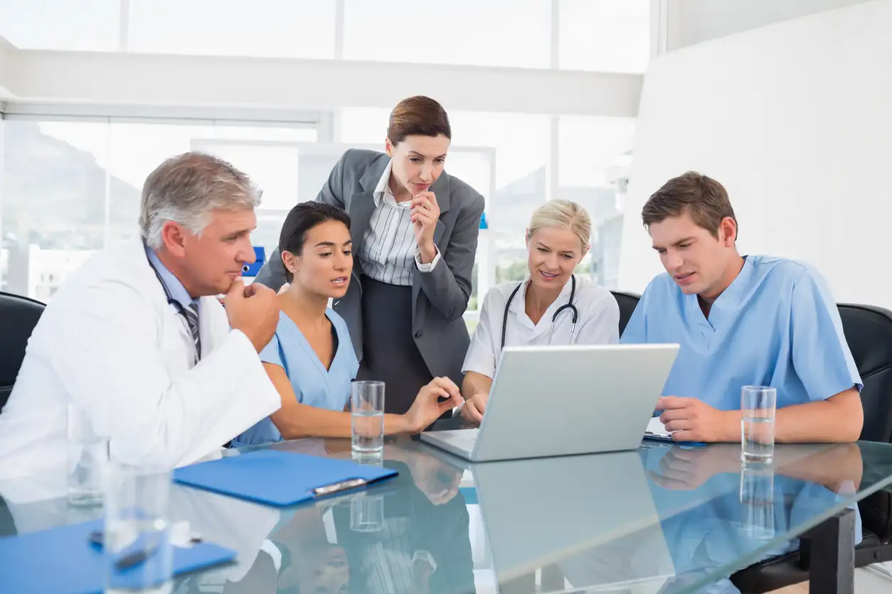 Team of providers creating connected practice workflows for scheduling clinical documentation billing and reporting